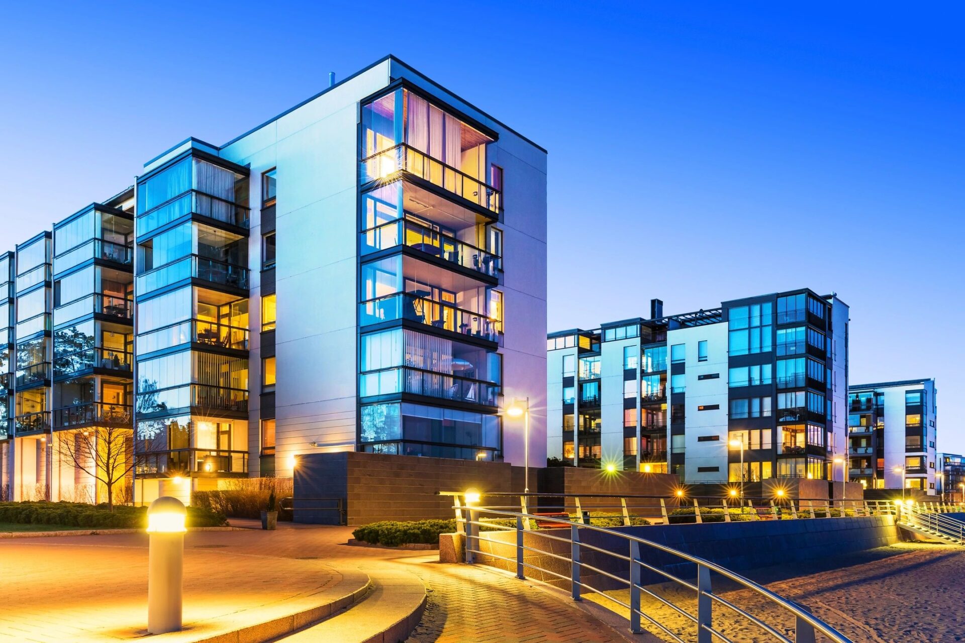 A building with many windows and lights on it